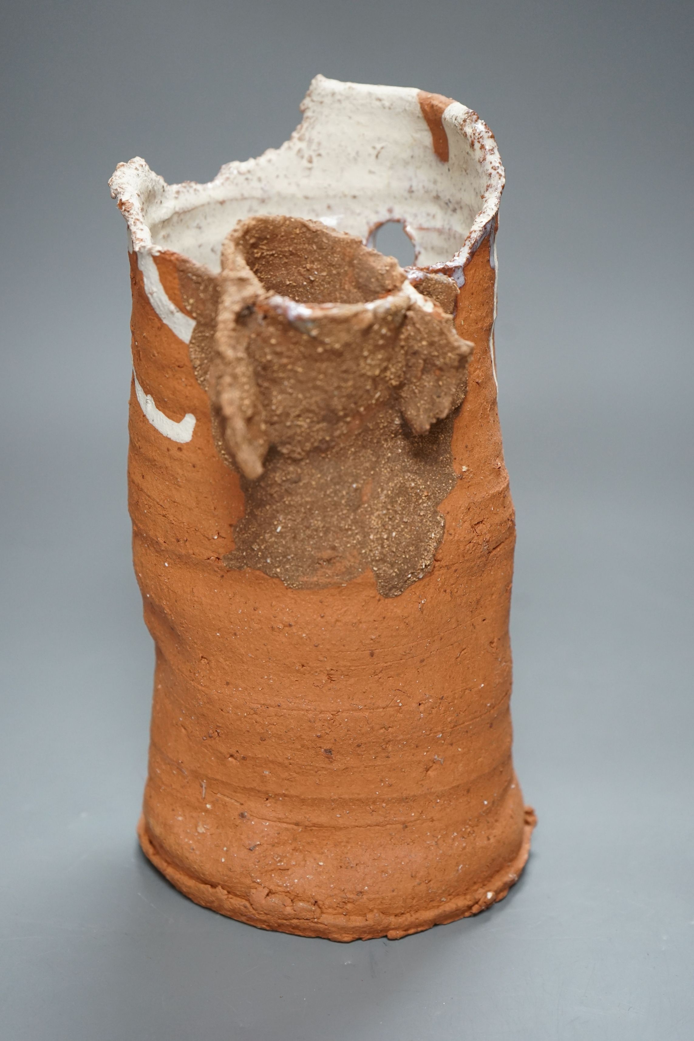 Peter Smith, a thrown terracotta cylindrical vessel with white glaze to the interior and brown nose vessel, with original purchase receipt, impressed mark to base rim, 26.5cm tall